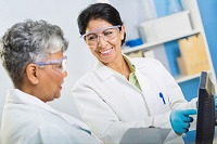 image of two women researchers viewing a computer screen